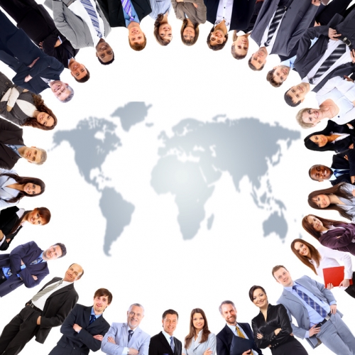 Group of people around a world map